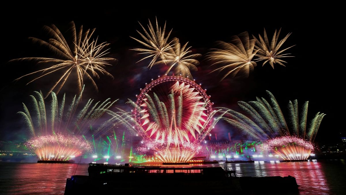 Fireworks explode over the London Eye as Britons across the country welcome the New Year, in London. Credit: Reuters Photo