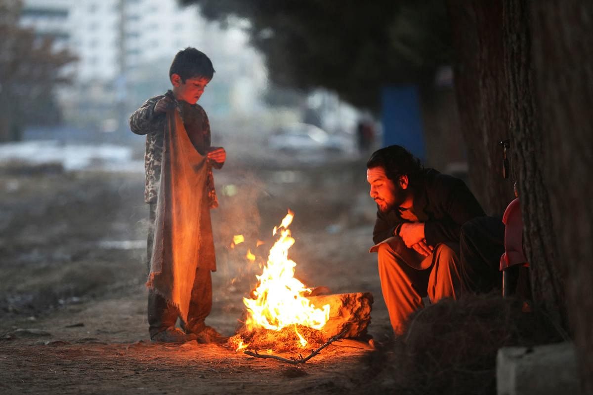 Afghans warm themselves by a bonfire on a winter day in Kabul. Credit: AFP Photo