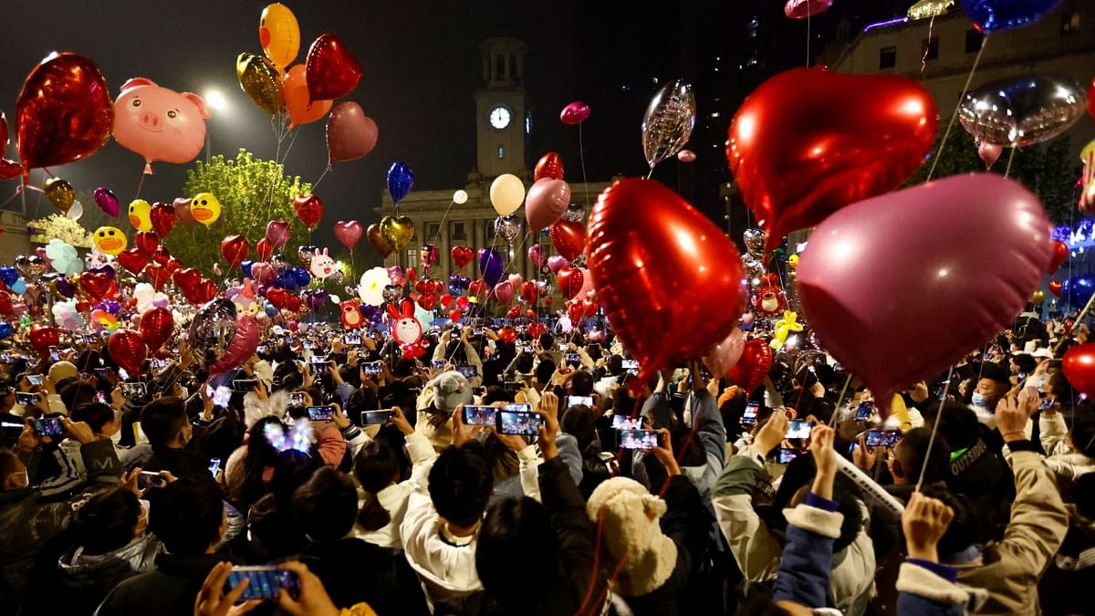 People release balloons as they gather to celebrate New Year's Eve, amid the coronavirus disease (Covid-19) outbreak, in Wuhan. Credit: Reuters Photo
