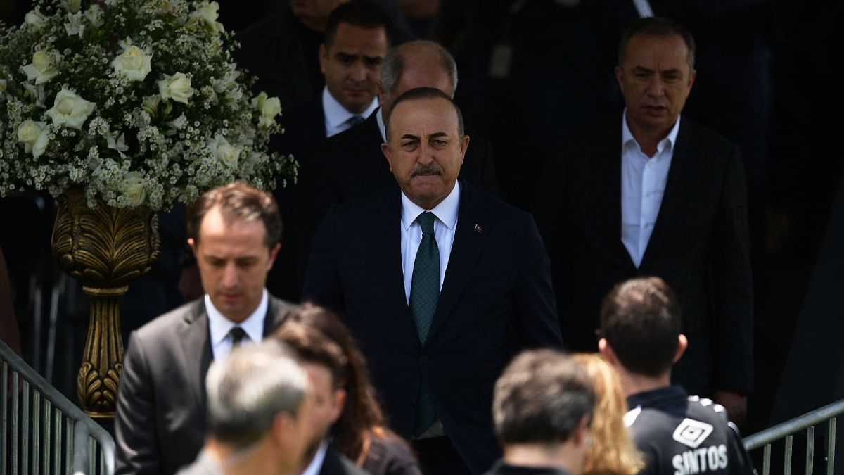 Turkish Foreign Affairs Minister Mevlut Cavusoglu arrives to pay his last respects to the football legend. Credit: AFP Photo