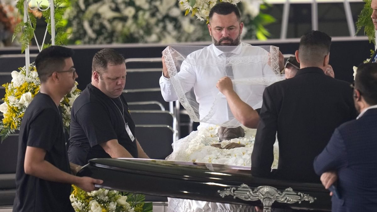 Pele's wake was being held at the Urbano Caldira Stadium, the home field of Pele's former team Santos, allowing fans to pay their last respects. Credit: AP/PTI Photo