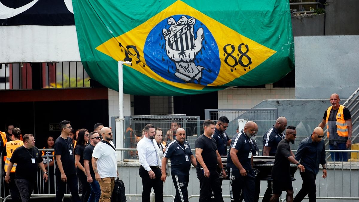 Scores of football fans thronged in the Brazilian city of Santos to pay their last respects to football legend Pele. Credit: AP Photo