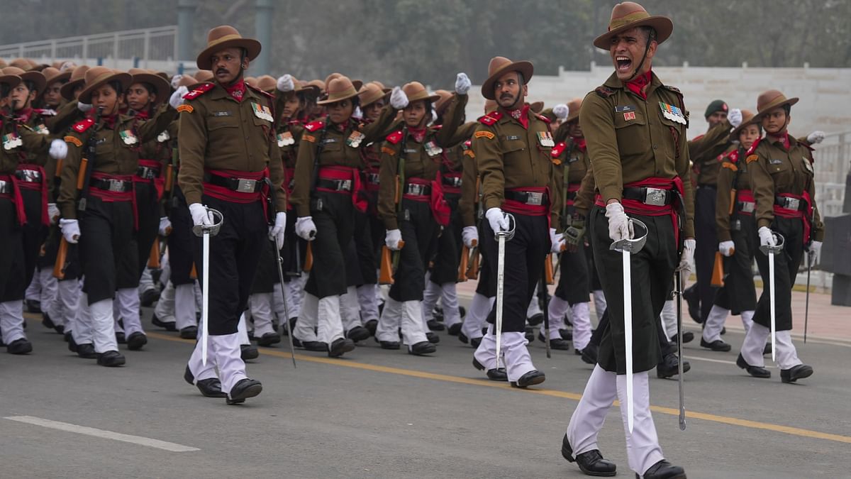 Indian soldiers were seen rehearsing in Delhi. With North India reeling under an intense cold wave, the mercury levels in Delhi had plummeted to 8.5 degrees Celsius. Credit: PTI Photo