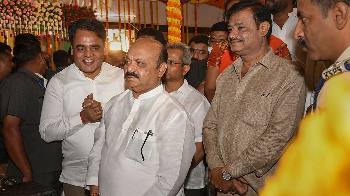 Karnataka Chief Minister Basavaraj Bommai with State Ministers CN Ashwath Narayan and Munirathna during his visit to Lord Venkateswara temple on the occasion of Vaikunta Ekadashi in Bengaluru. Credit: PTI Photo