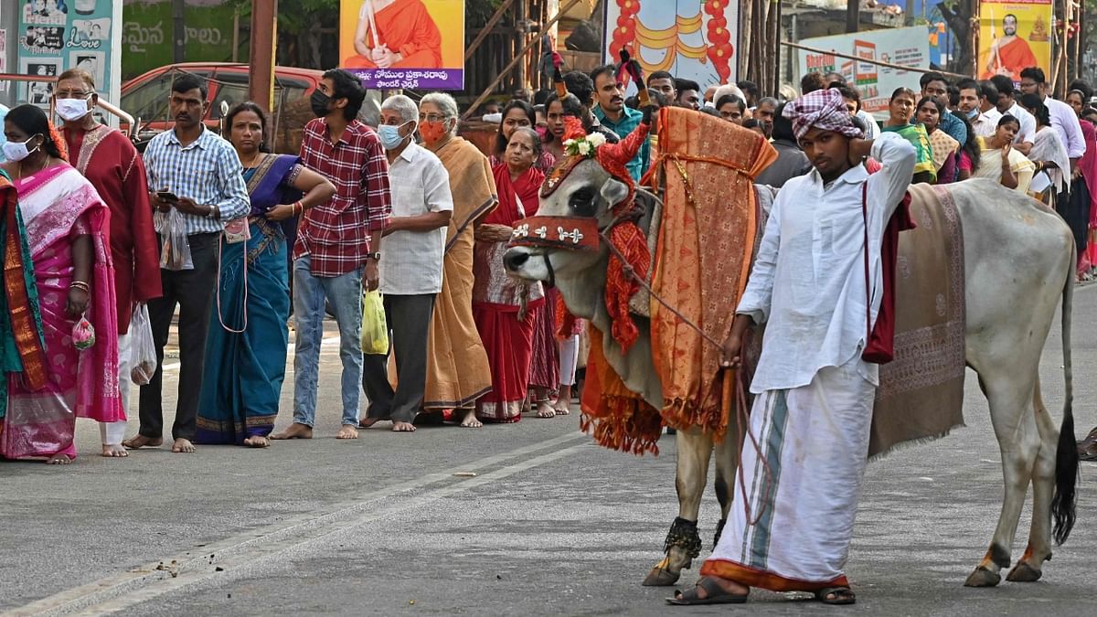 Devotees stand in a queue to offer prayers at Lord Venkateswara temple in Hyderabad. Credit: AFP Photo
