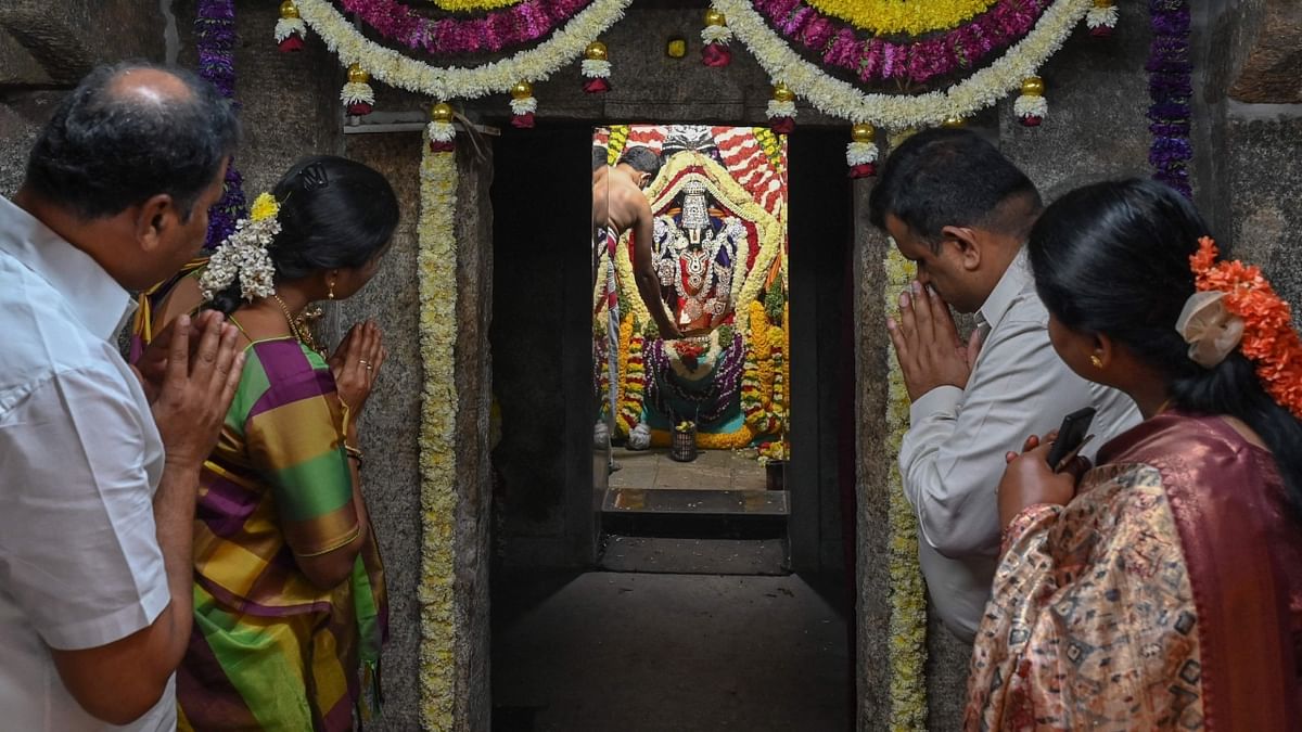 Amid the Covid-19 scare, devotees offered prayers at various prominent Lord Vishnu temples across the country on the occasion of Vaikuntha Ekadashi. Credit: AFP Photo