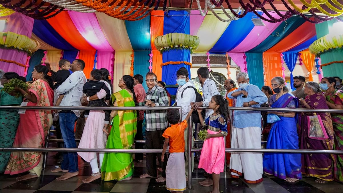 Devotees stand in queues to offer prayers to Lord Venkateswara at a temple in Bengaluru. Credit: PTI Photo