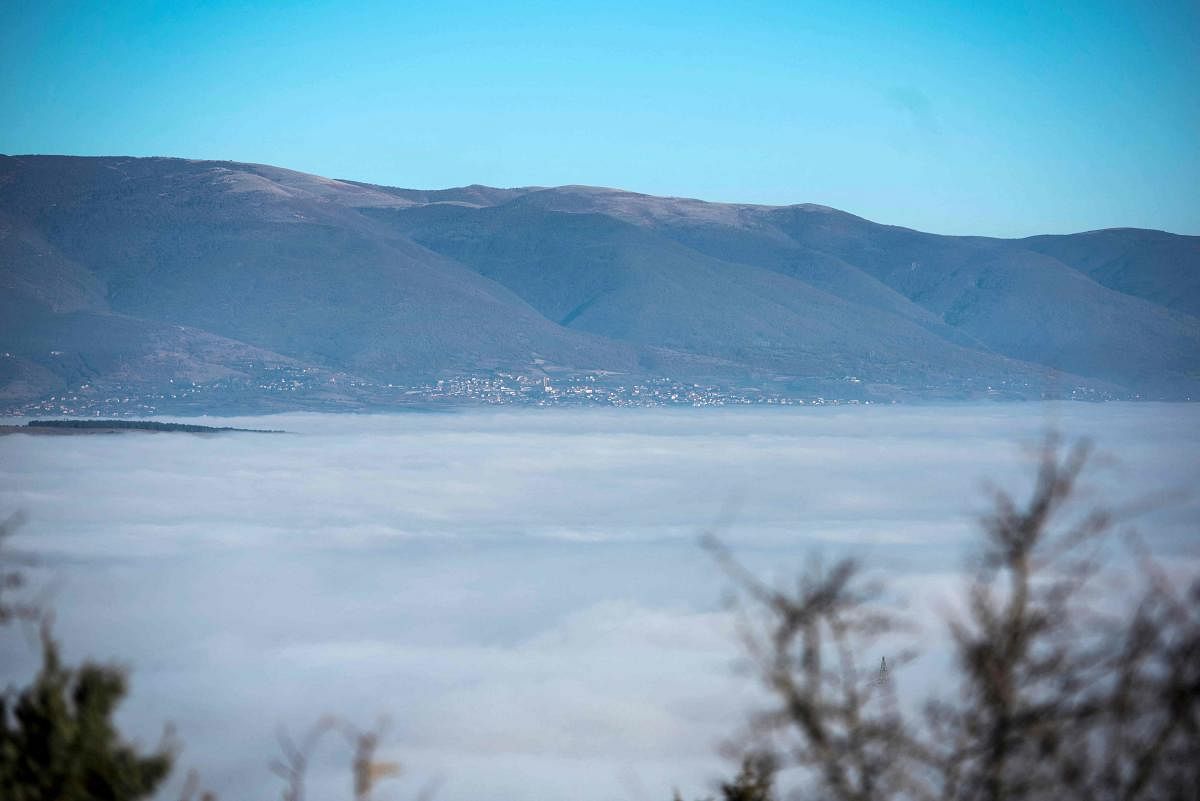 A general view of Skopje's valley surrounded by fog. Citizens of Skopje, especially those living in houses, use wood to heat up during the winter, as the country has no reliable supply of natural gas. According to IQAir, a Swiss air quality technology company, last ten days, North Macedonian capital was three times ranked among most polluted cities in the world.  Credit: AFP Photo