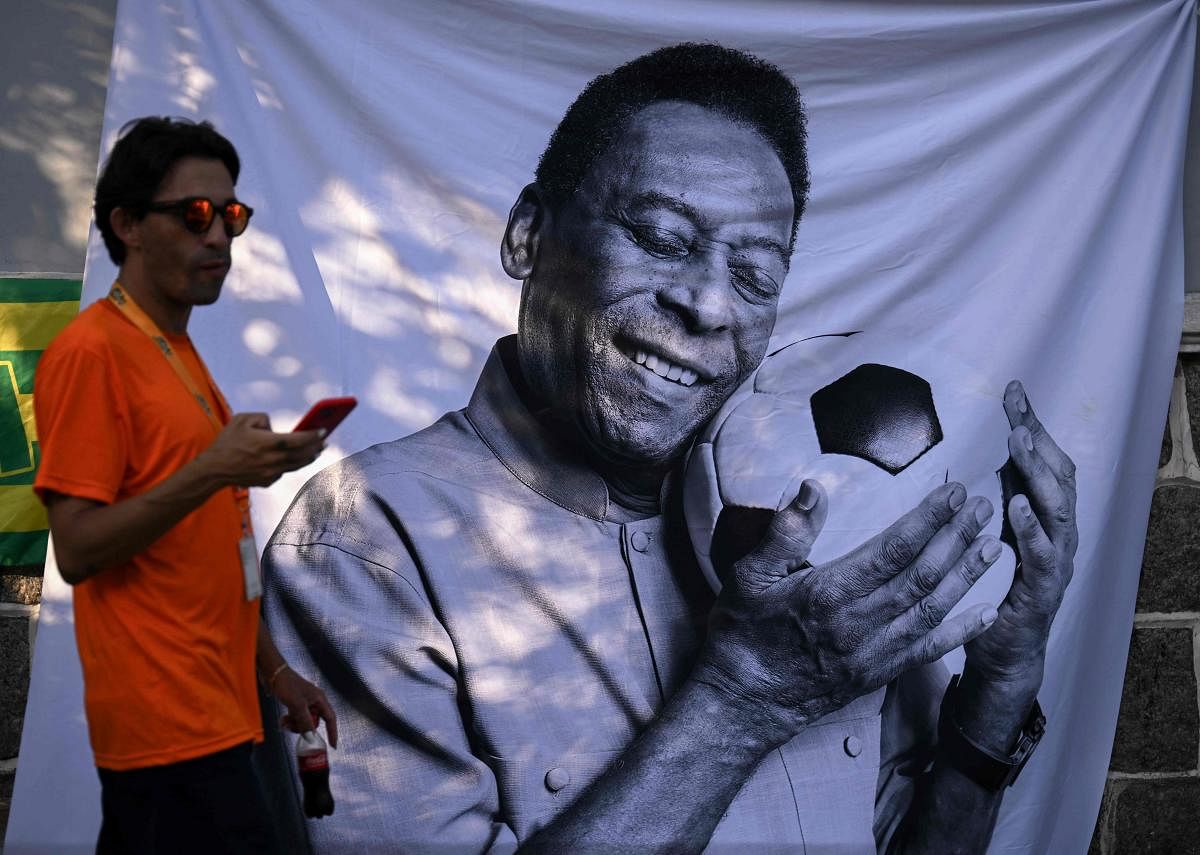 Brazilians bid a final farewell this week to football giant Pele, starting Monday with a 24-hour public wake at the stadium of his long-time team, Santos. Credit: AFP Photo