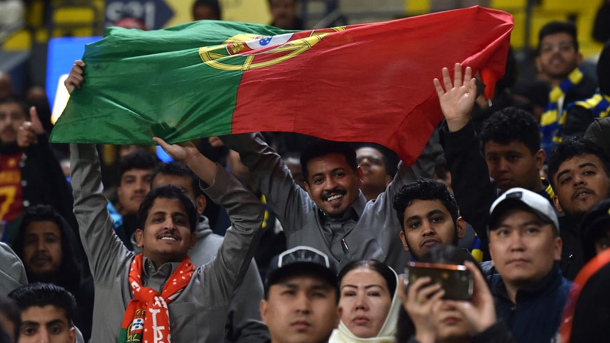 Many Al-Nassr supporters waved the Portugal flag during Ronaldo's unveiling to salute the legend's contributions to international football. Credit: AFP Photo