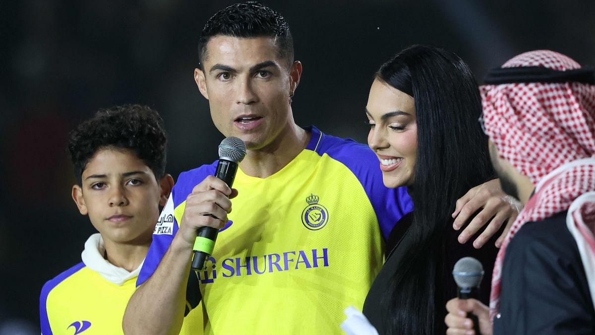 Ronaldo speaks as his partner Georgina Rodriguez looks on at the Mrsool Park Stadium in the Saudi capital Riyadh. Credit: AFP Photo