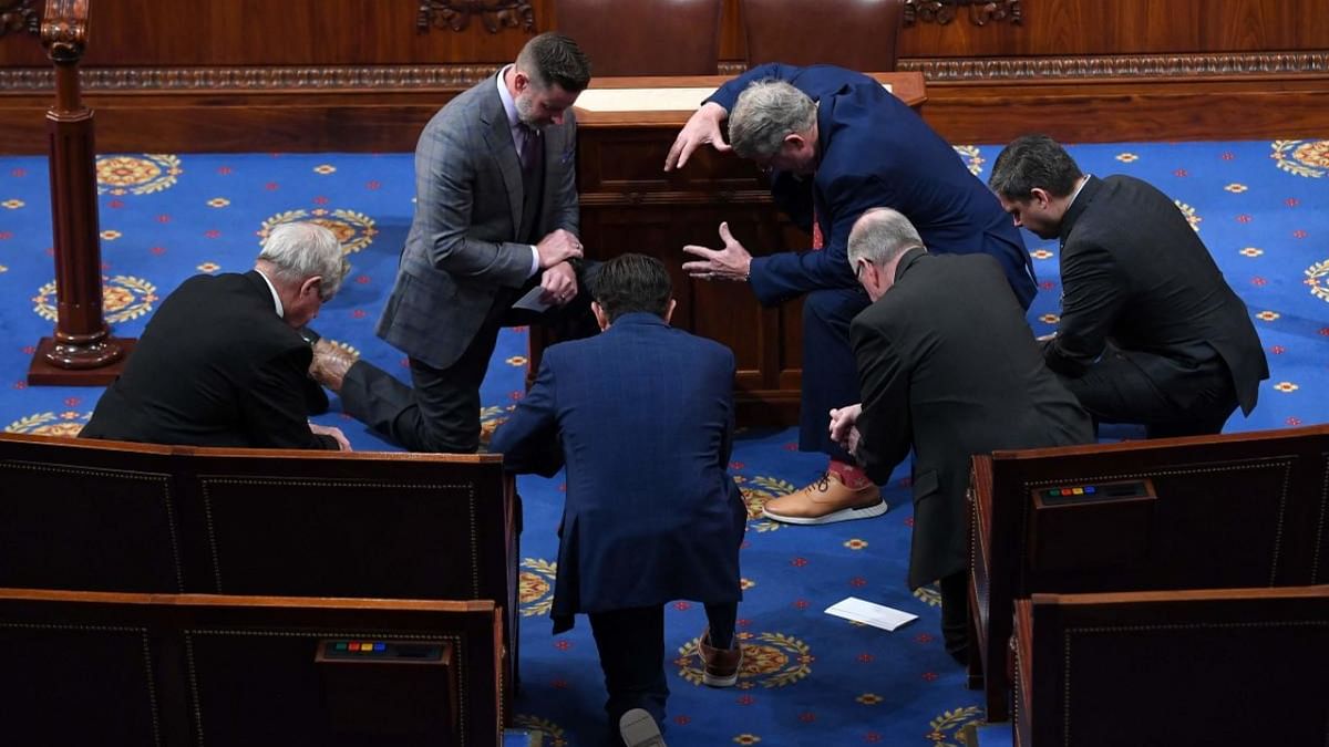 Republican members of the US House of Representatives pray in the House Chamber at the US Capitol in Washington, DC, on January 6, 2023, before the fourth session to elect a House Speaker. Credit: AFP Photo