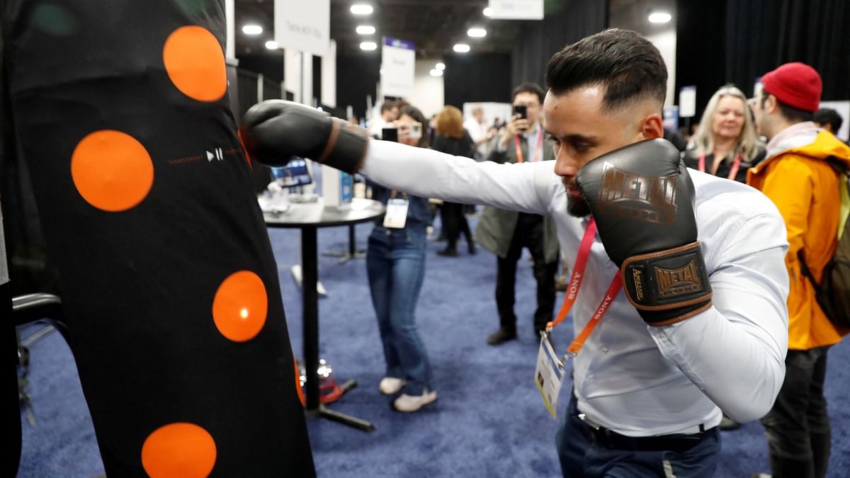The I-Perskin, a wireless sack that slips over any punching bag, features light-up targets and flexible electronic sensors that guide workouts and analyse the user's strength and accuracy. A mobile app helps set workouts and review performance. Credit: Reuters Photo
