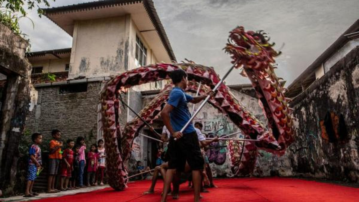 A dragon dance troupe practice their moves in Bogor ahead of Lunar Year celebrations. Credit: AFP Photo