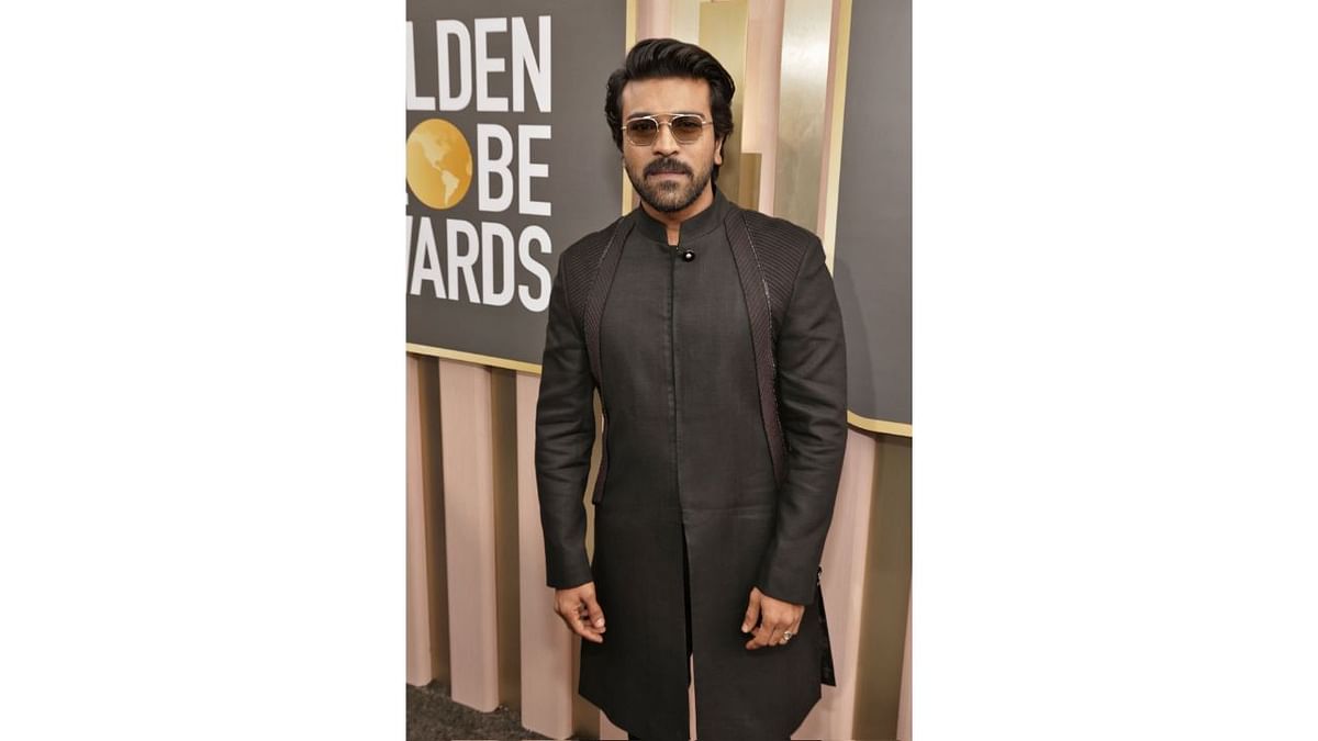 Ram Charan looked sharp and slick in a black sherwani set by Tarun Tahiliani. Credit: Special Arrangement