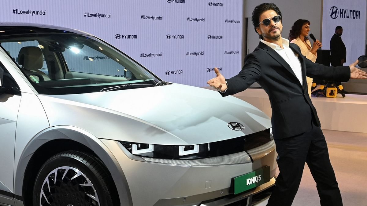 SRK strikes his signature pose. Credit: AFP Photo