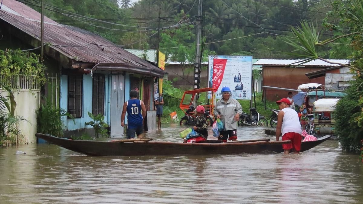 In Pics | 70,000 displaced, 17 killed by floods in Philippines