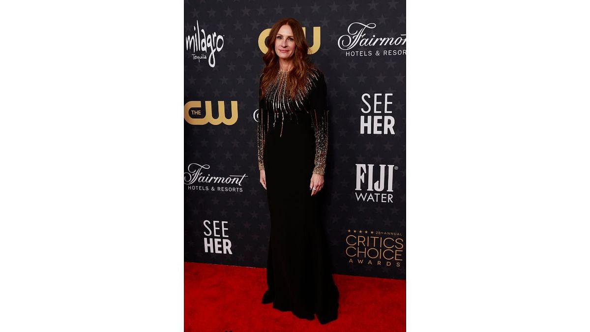 Julia Roberts donned an elegant black Schiaparelli gown with gold sequins and that sure worked in her favour. Credit: AFP Photo