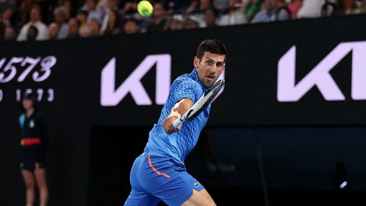 Serbia's Novak Djokovic hits a return against Spain's Roberto Carballes Baena during their men's singles match on day two of the Australian Open tennis tournament in Melbourne. Credit: AFP Photo