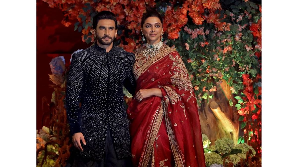 Bollywood's powercouple Ranveer Singh and Deepika Padukone marked attendance as well where Deepika chose to wear a red saree with heavy border, and Ranveer went with black shimmer kurta. Credit: Reuters Photo