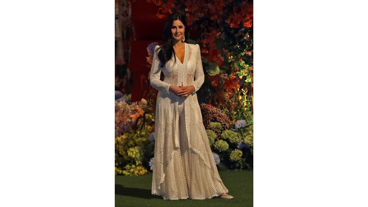 Dressed in a white outfit, Katrina Kaif came opted a simple yet classy look for the engagement ceremony. Credit: AFP Photo