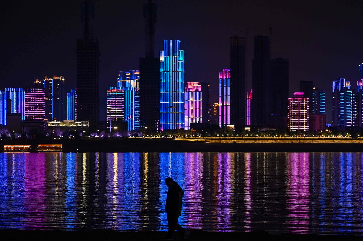 A man walks by the banks of the Yangtze river in Wuhan in China's central Hubei province. Credit: AFP Photo