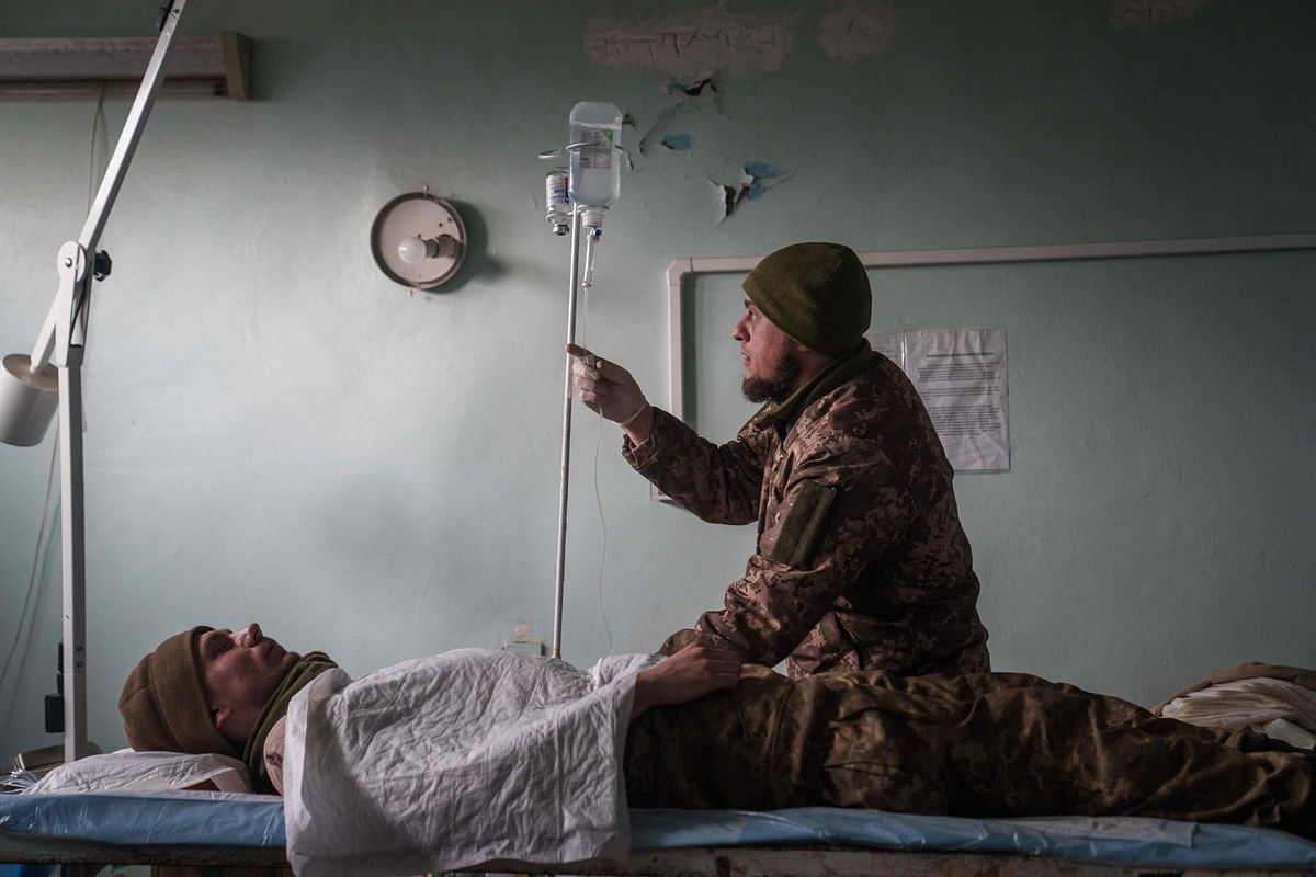 A Ukrainian military medic treats a slightly wounded Ukrainian soldier in stabilization unit near the front line in Donetsk region, eastern Ukraine. Credit: AFP Photo