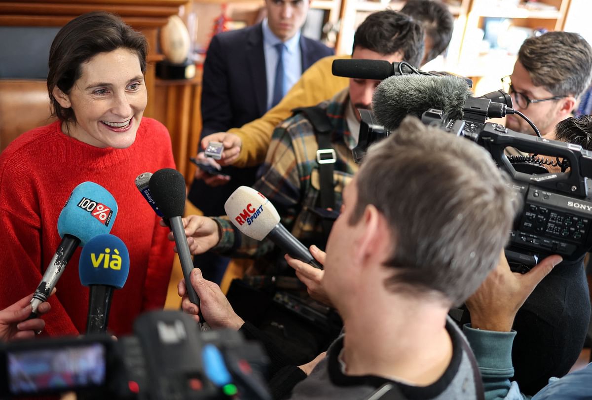 France's Sports Minister Amelie Oudea-Castera (L) addresses media, after the signing ceremony of the charter of 15 eco-responsible commitments between the rugby club and the Minister at the Ernest-Wallon stadium in Toulouse, southwestern France. Credit: AFP Photo