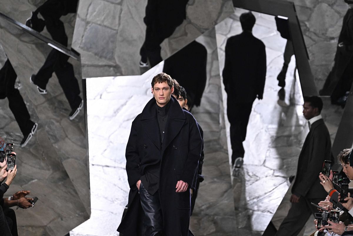 A model presents a creation during the Menswear Ready-to-wear Fall-Winter 2023-2024 collection show for Hermes at Paris fashion week. Credit: AFP Photo