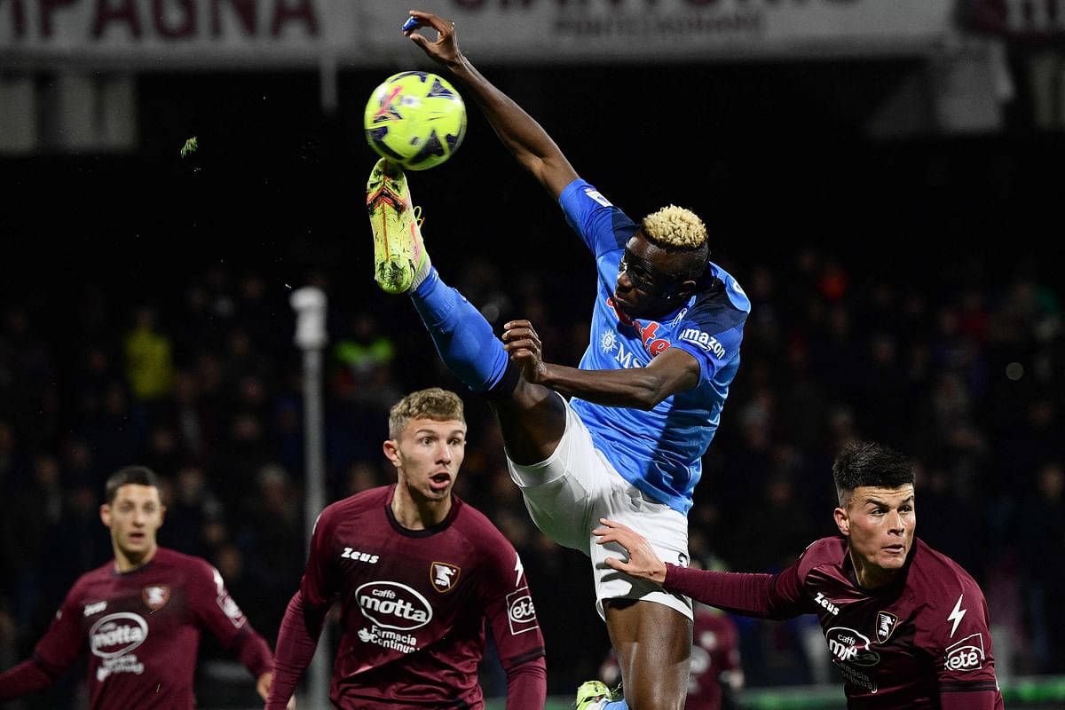 Napoli's Nigerian forward Victor Osimhen (Top) goes for a kick during the Italian Serie A football match between Salernitana and Napoli. Credit: AFP Photo