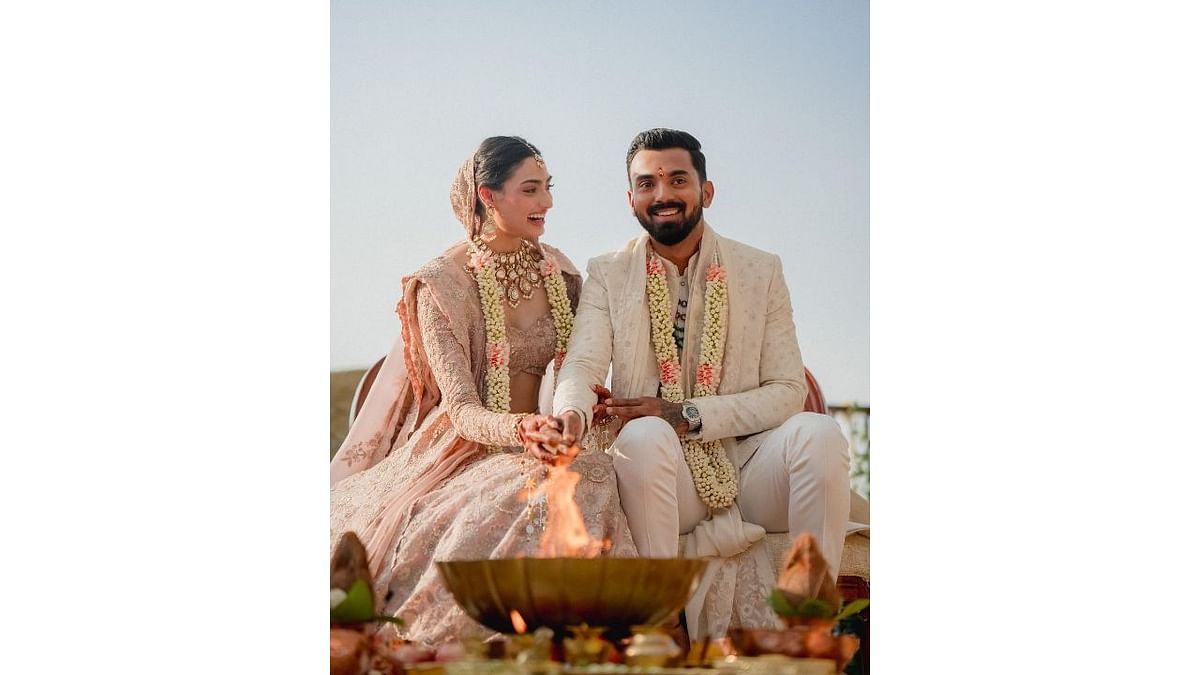 The couple took to Instagram to share beautiful photos of the private wedding ceremony that took place in Suniel Shetty's Khandala Farm House. Credit: Instagram/@athiyashetty