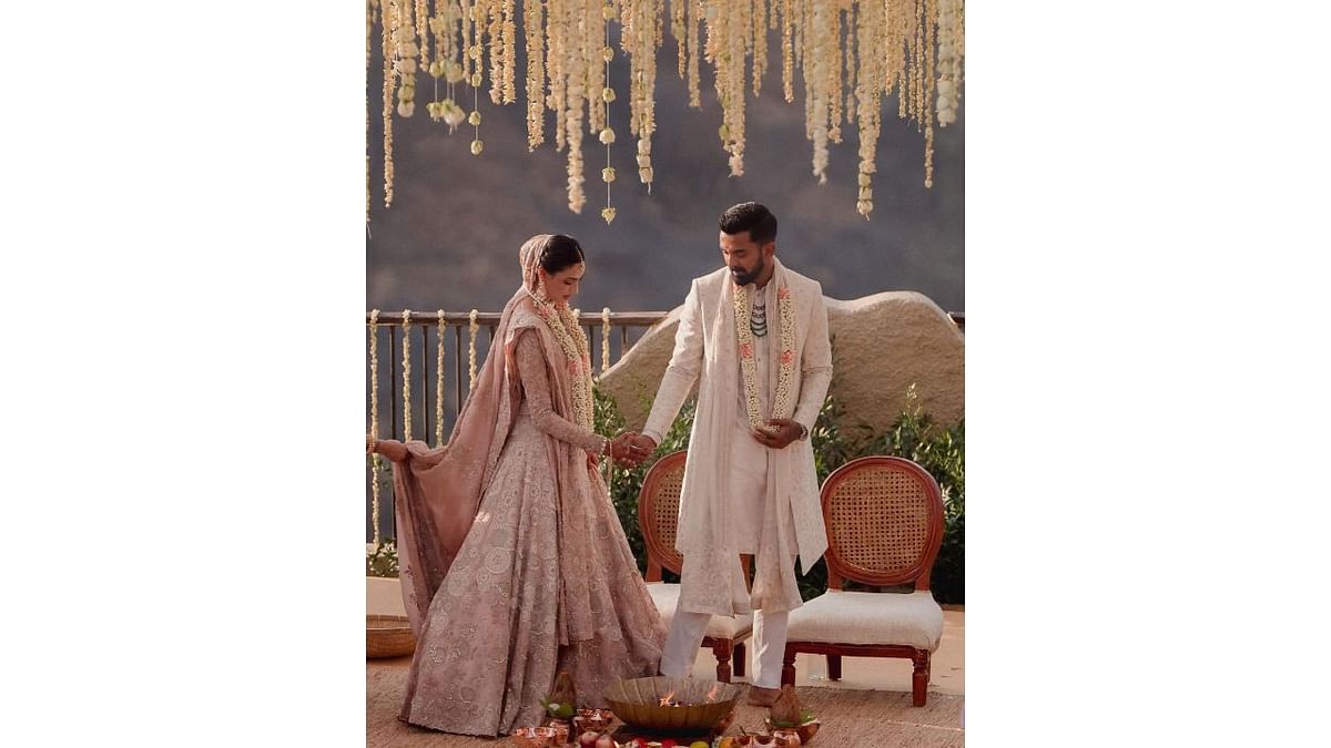 Dressed in their white and gold wedding attires, Rahul and Athiya looked like a vision to behold. Credit: Instagram/@athiyashetty