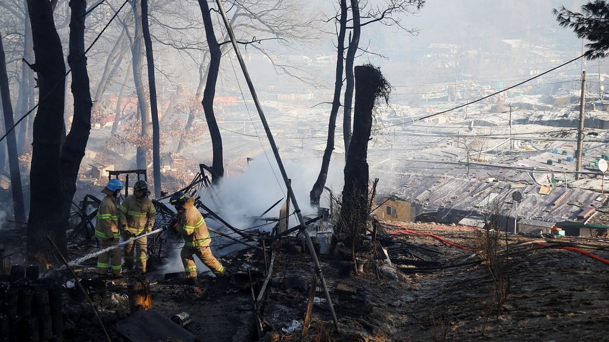 A massive fire spread through a neighbourhood of densely packed, makeshift homes in South Korea's capital, destroyed at least 60 and forcing about 500 residents to flee. Credit: Reuters Photo