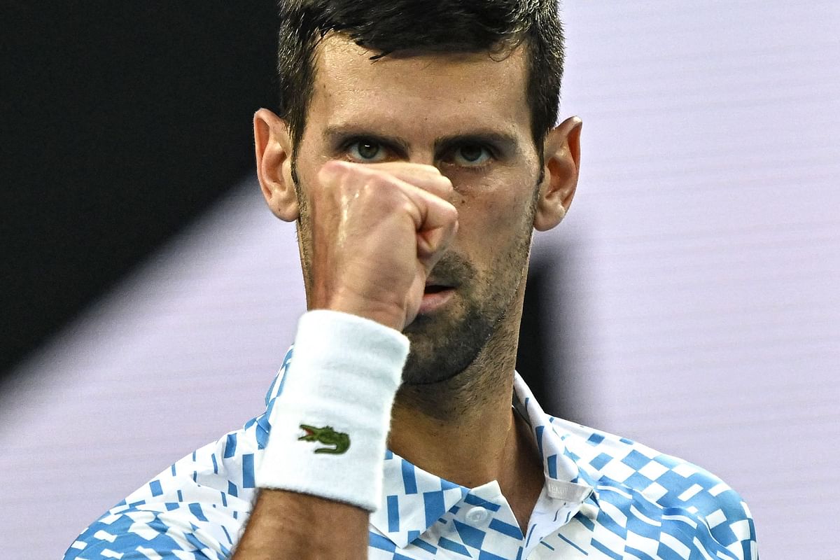 Serbia's Novak Djokovic reacts as he competes against Australia's Alex De Minaur during their men's singles match on day eight of the Australian Open tennis tournament in Melbourne. Credit: AFP Photo