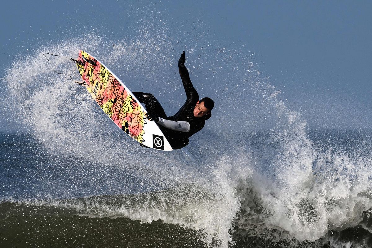 This photograph shows French surfer Maxime Huscenot during a training session in Hossegor, southwestern France. Credit: AFP Photo
