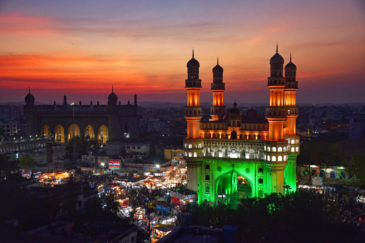 Charminar is illuminated in the colours of the national flag on the eve of Republic Day, in Hyderabad. Credit: PTI Photo