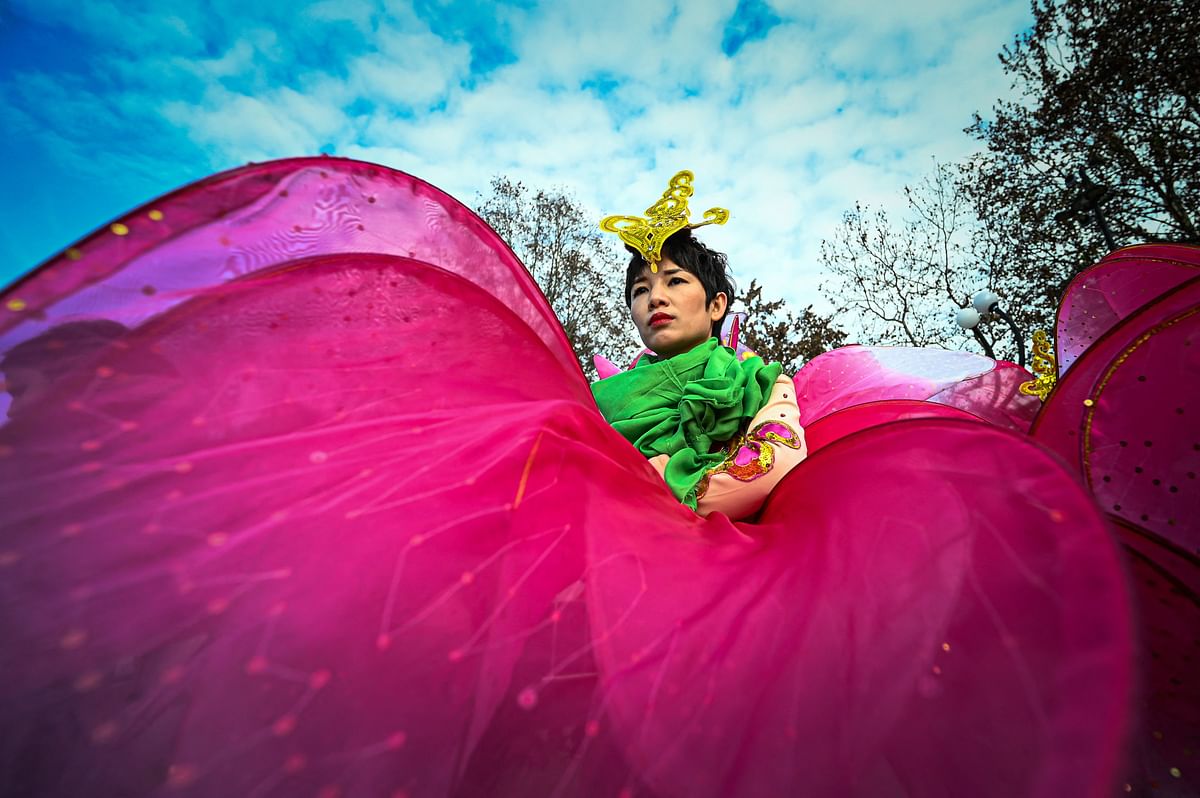 A performer takes part in a parade celebrating the Chinese Lunar New Year of the Rabbit, in central Milan, Italy. Credit: AFP Photo