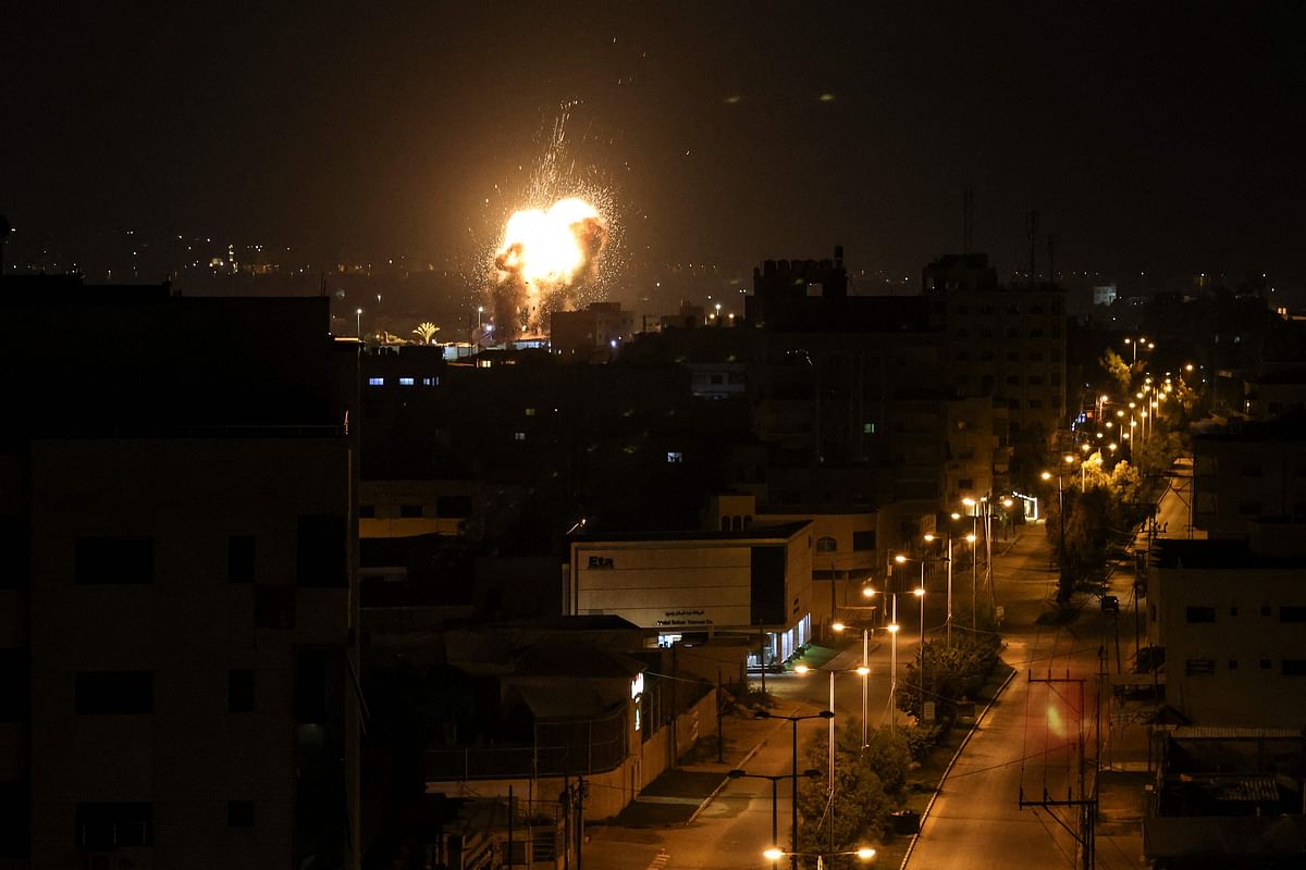 Fire and smoke rise above buildings in Gaza City as Israel launched air strikes on the Palestinian enclave early on January 27, 2023. Credit: AFP Photo