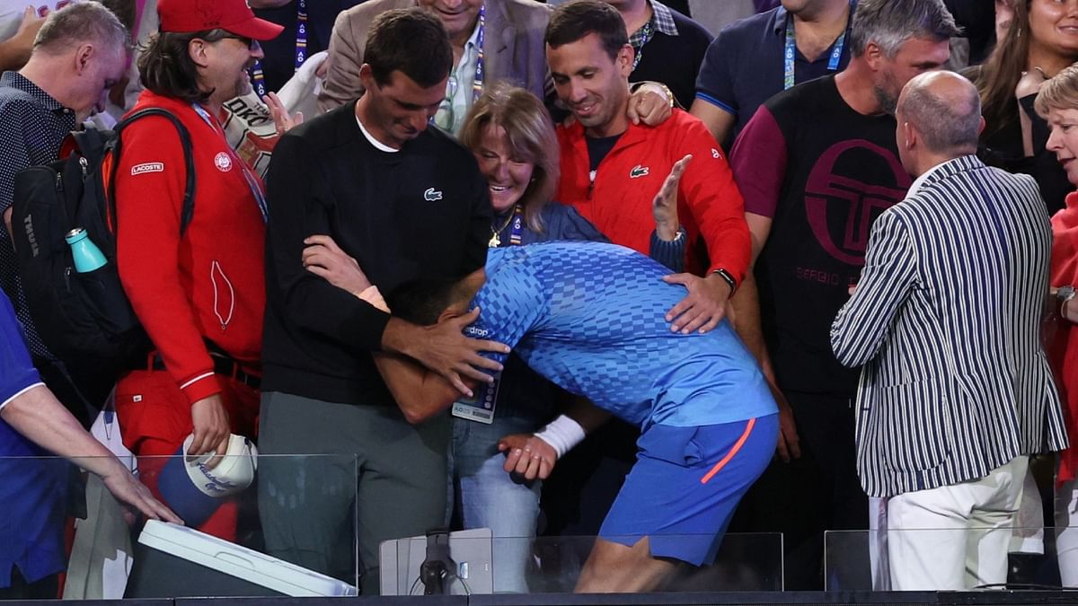 Novak Djokovic climbed to his player's box afterwards to embrace his mother and broke down in uncontrollable tears, collapsing to the ground sobbing. Credit: AFP Photo