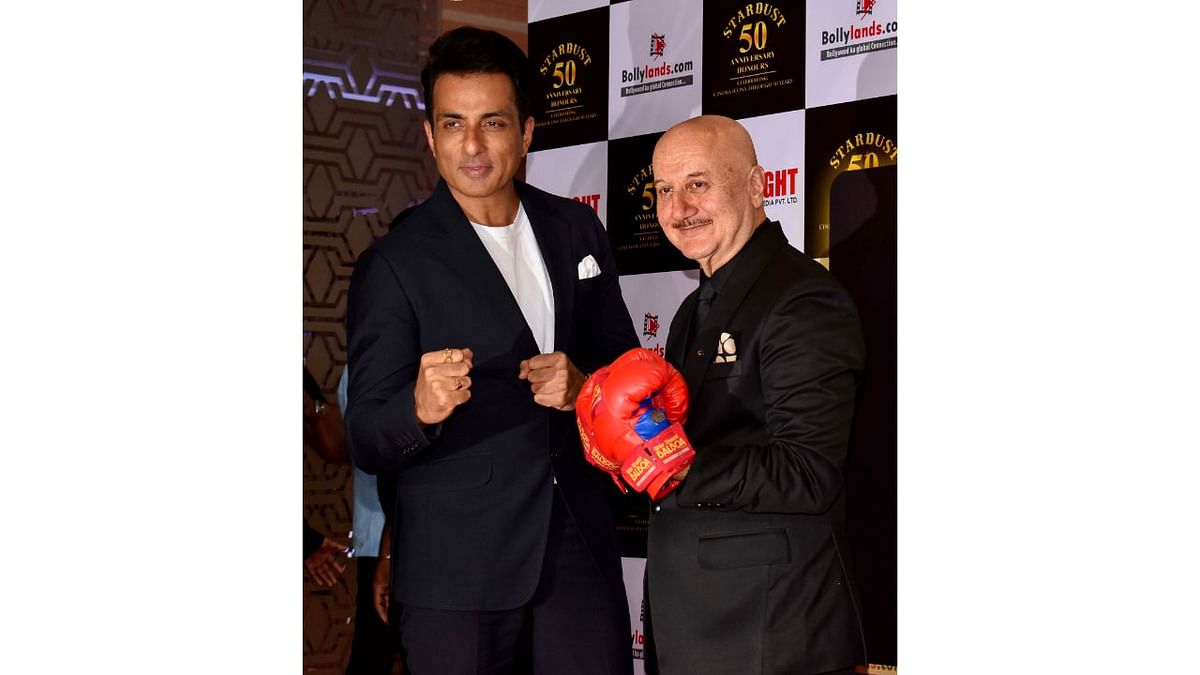 Sonu Sood poses on the red carpet with Anupam Kher during Stardust magazine's 50th anniversary party in Mumbai. Credit: PTI Photo