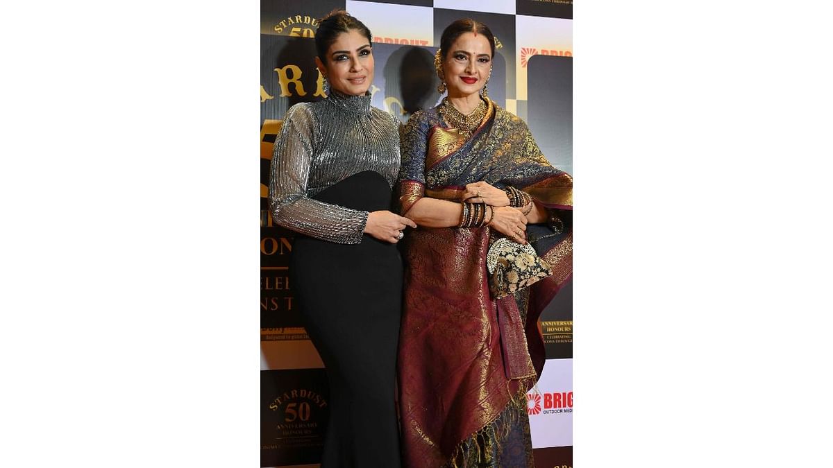 Raveena Tandon with legendary actress Rekha at the 50th anniversary party of Stardust Magazine. Credit: AFP Photo