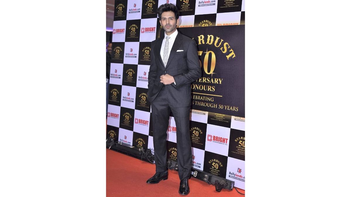 'Shehzada' Kartik Aaryan looked dapper in a suit at the 50th anniversary party of Stardust Magazine in Mumbai. Credit: PTI Photo