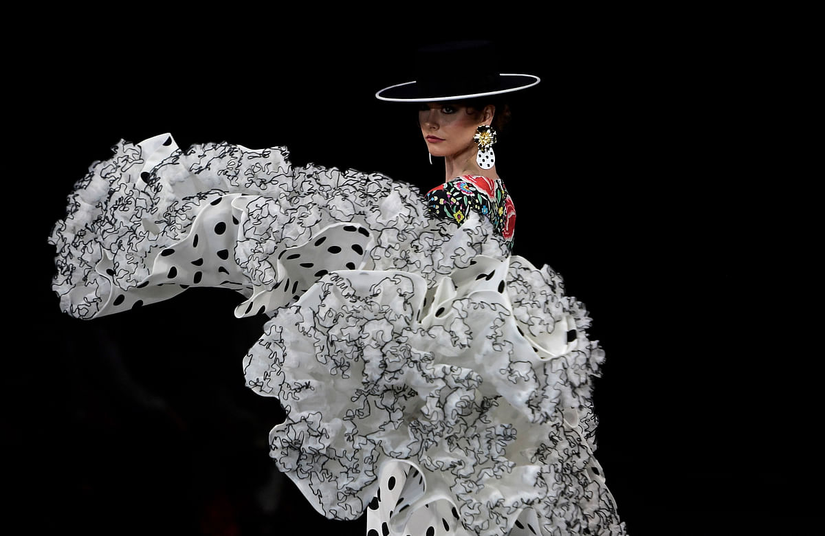 A model presents a creation by Con T D'Touche during the Simof 2023 (International Flamenco Fashion Show) in Sevilla on January 29, 2023. Credit: AFP Photo