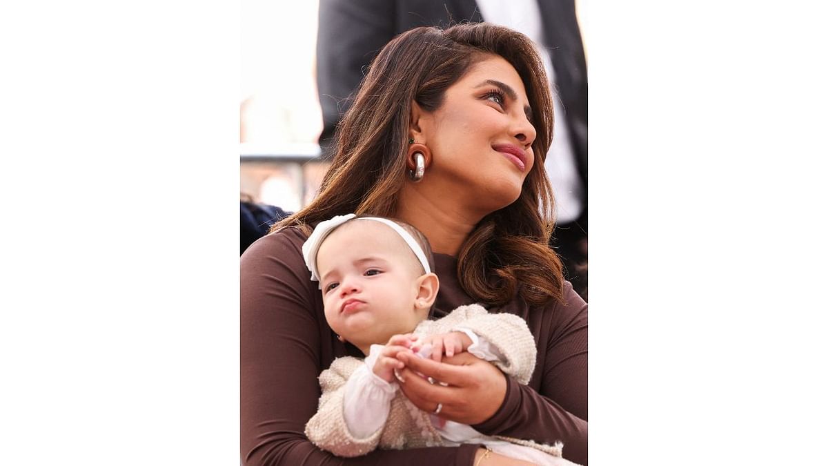 An adorable picture of Priyanka Chopra with her budle of joy, Malti. Credit Reuters Photo