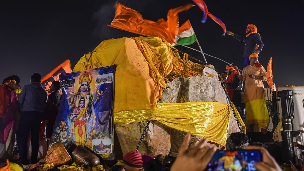 Volunteers and devotees wave India and Nepal's flags at Ramsevak Puram in Ayodhya. Credit: PTI Photo