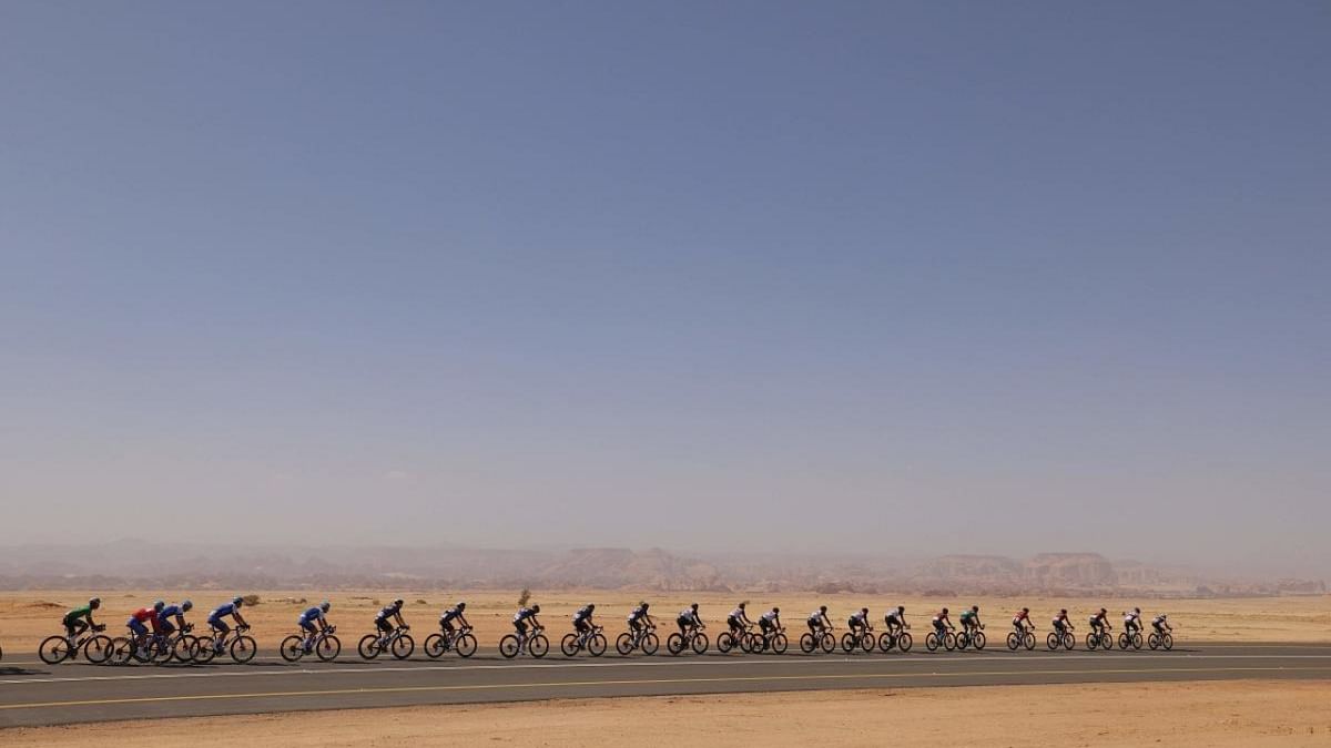 The pack rides during the fourth stage of 2023 Saudi Tour, from Maraya to Skyviews of Harrat Uwayrid. Credit: AFP Photo