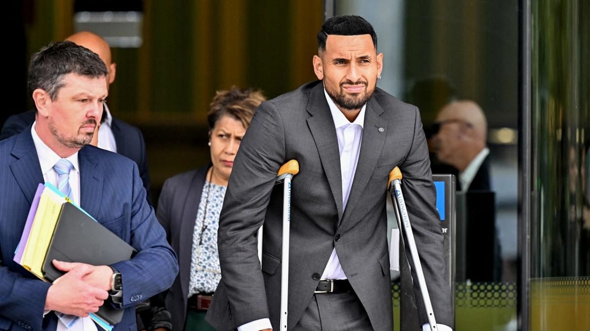 Australian tennis player Nick Kyrgios (R) leaves the magistrate's court in Canberra. Credit: AFP Photo