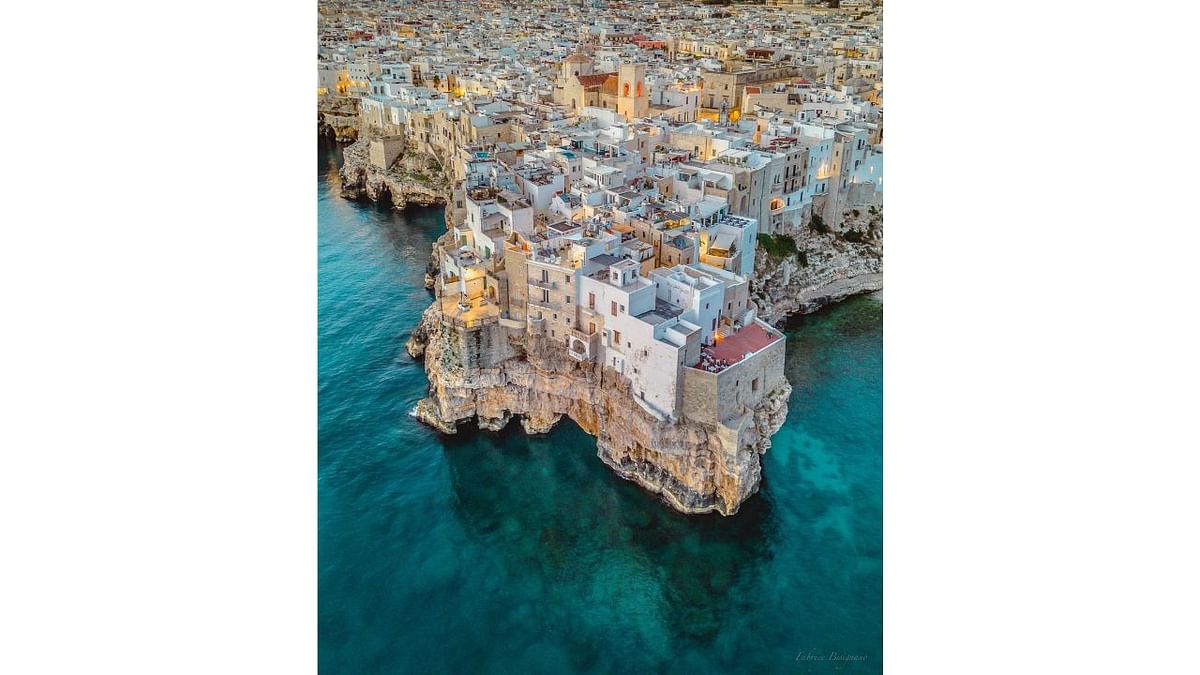 Polignano a Mare located on the Adriatic Sea in Italy has topped the list of the 'Most Welcoming Cities on Earth'. Credit: Twitter/@corona
