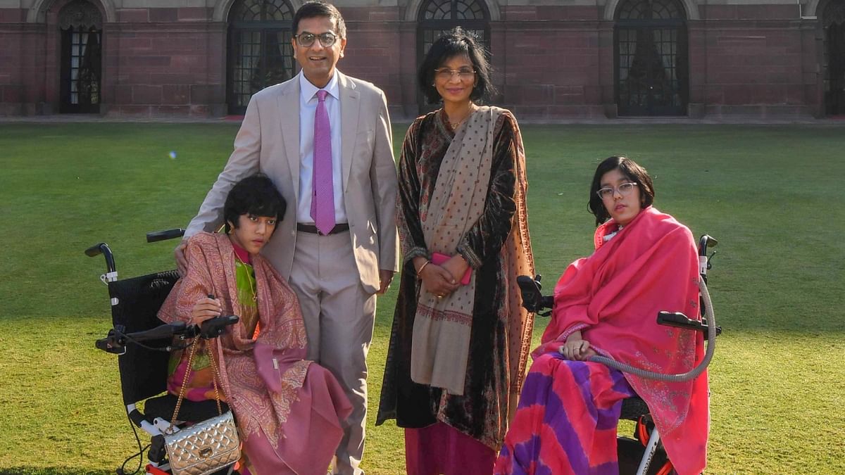 CJI Dr D Y Chandrachud poses with family during his visit to Amrit Udyan, earlier known as Mughal Garden, in the Rashtrapati Bhavan, Delhi. Credit: Twitter/@rashtrapatibhvn