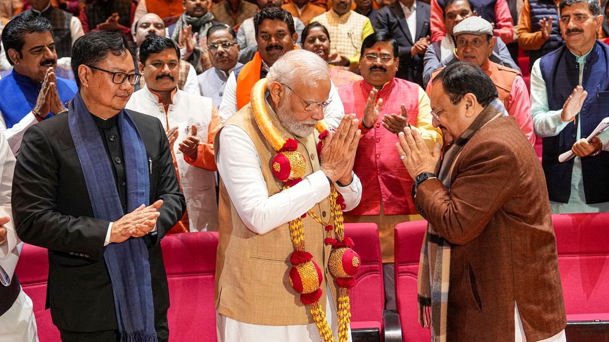Prime Minister Narendra Modi being felicitated by BJP National President JP Nadda for the Union Budget 2023-24 during the BJP Parliamentary Party meeting in New Delhi. Credit: PTI Photo